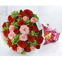 Bouquet composed of 16 blooming red roses and 9 pink roses, accented by bupleurum and fresh greens.