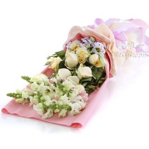 Bouquet composed of 11 champagne roses, accented by snapdragons, white & purple lisianthus and fresh greens.