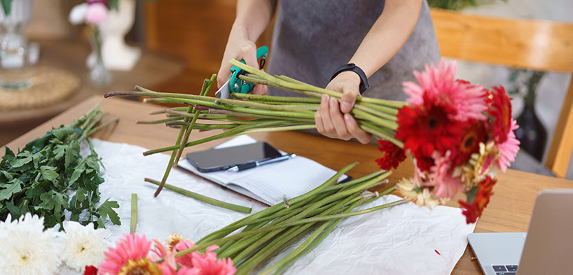 Gerbera flowers being prepared by a local florist